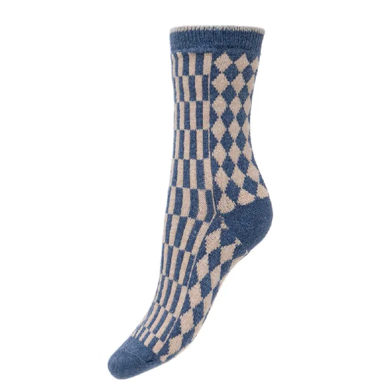 Women's thigh - high socks in a fishnet patternBlue and cream wool blend geometric patterned socks